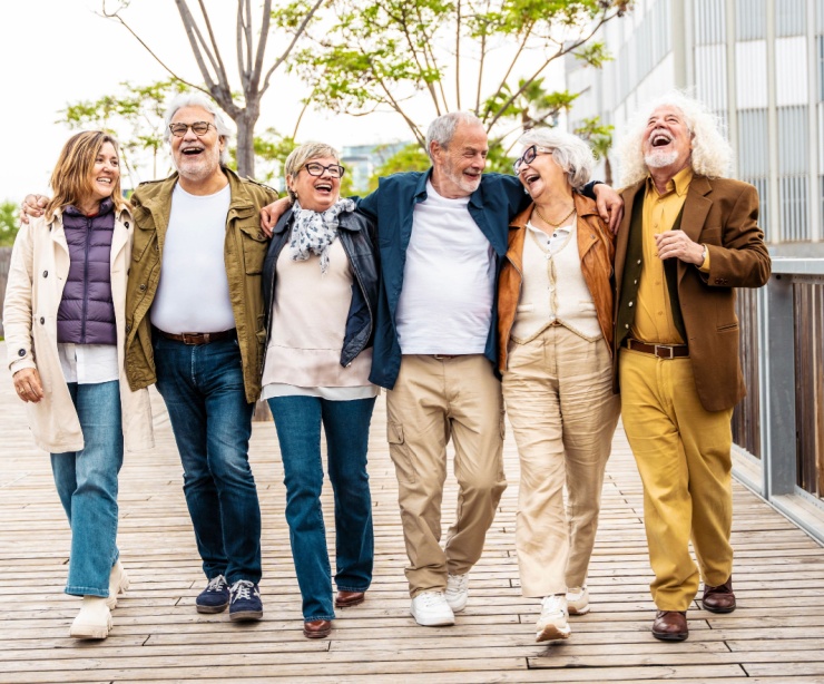 A group of people walking together and laughing.