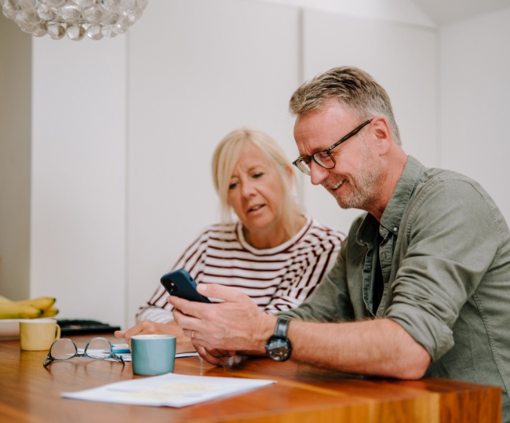 A couple going through paperwork together.