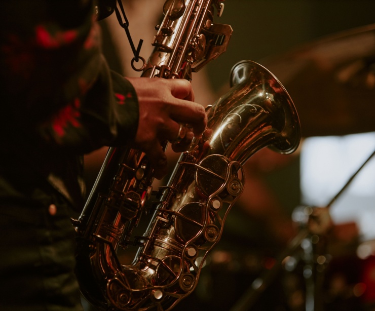 Someone playing a saxophone.