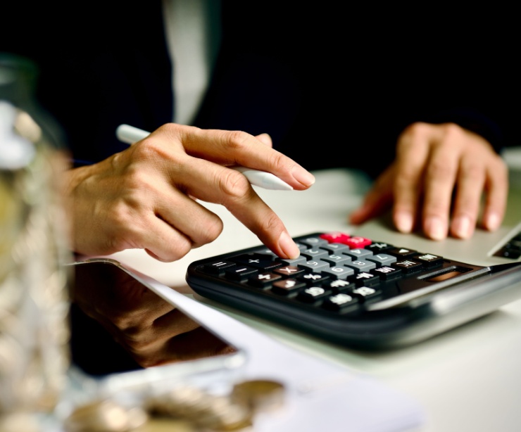A person using a calculator.