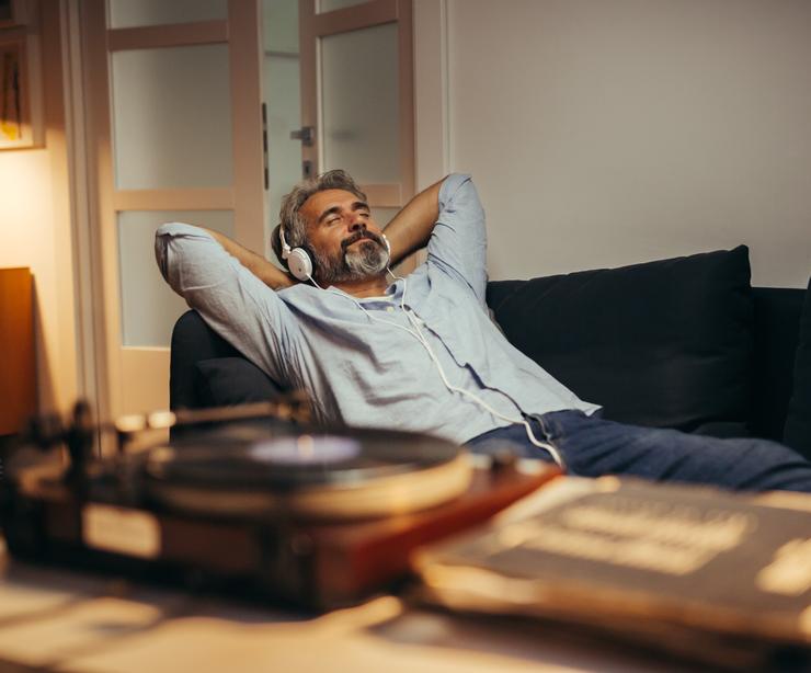 A man relaxing while listening to music.