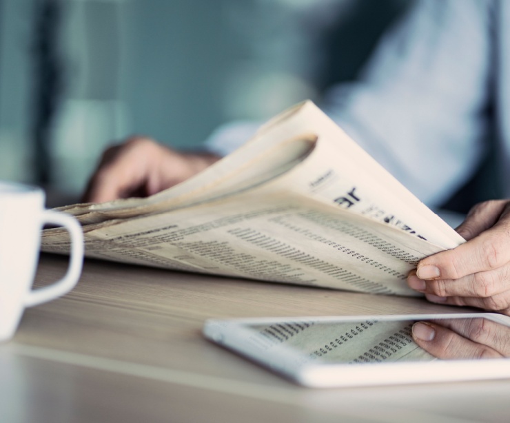 A man reading a newspaper.