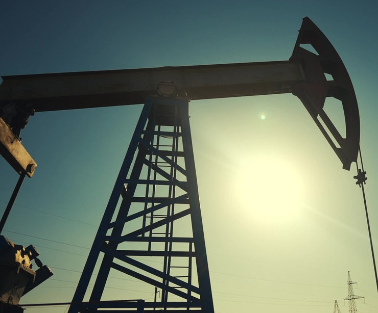 A silhouette of an oil pump.