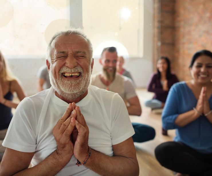 A group of people meditating.