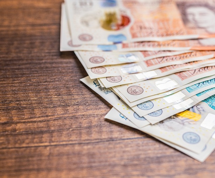 UK bank notes on a table.